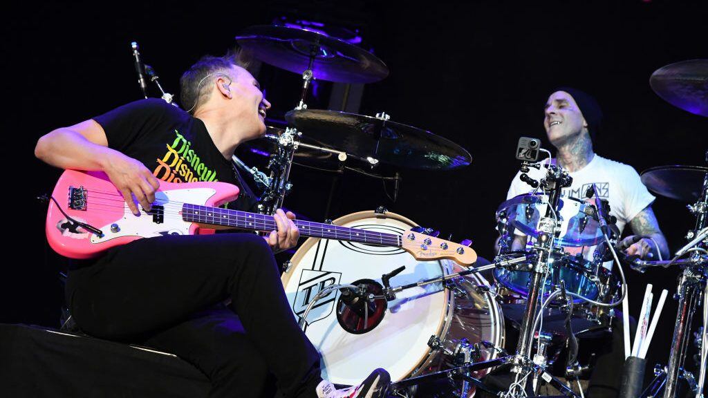 INGLEWOOD, CALIFORNIA - JANUARY 18: (FOR EDITORIAL USE ONLY) (L-R) Mark Hoppus and Travis Barker of blink-182 perform onstage at the 2020 iHeartRadio ALTer EGO at The Forum on January 18, 2020 in Inglewood, California. (Photo by Jeff Kravitz/FilmMagic for iHeartMedia )