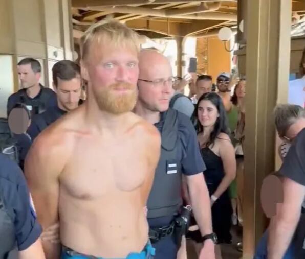 He was seen being arrested on the viewing platform of the historic landmark Credit: X