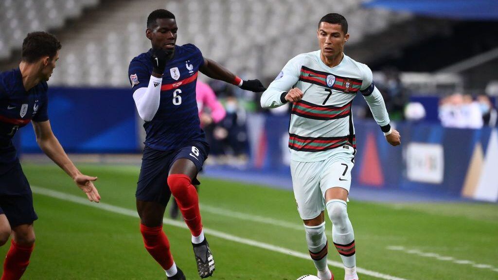 Portugal's forward Ronaldo (R) vies with France's midfielder Paul Pogba during of the Nations League football match between France and Portugal, on October 11, 2020 at the Stade de France in Saint-Denis, outside Paris. (Photo by FRANCK FIFE / AFP) (Photo by FRANCK FIFE/AFP via Getty Images)