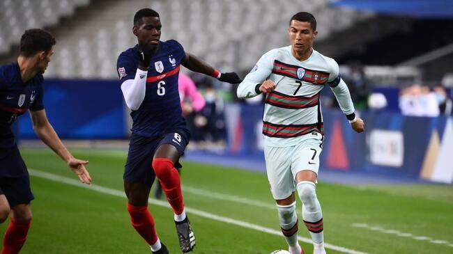 Portugal's forward Ronaldo (R) vies with France's midfielder Paul Pogba during of the Nations League football match between France and Portugal, on October 11, 2020 at the Stade de France in Saint-Denis, outside Paris. (Photo by FRANCK FIFE / AFP) (Photo by FRANCK FIFE/AFP via Getty Images)