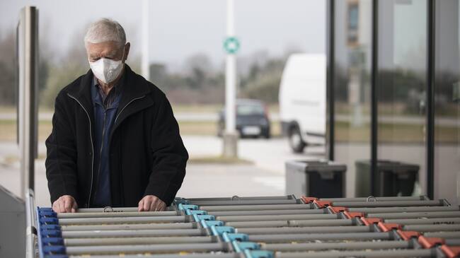 Senior Adult Man Wearing Protective Face Mask When Visiting Supermarket.