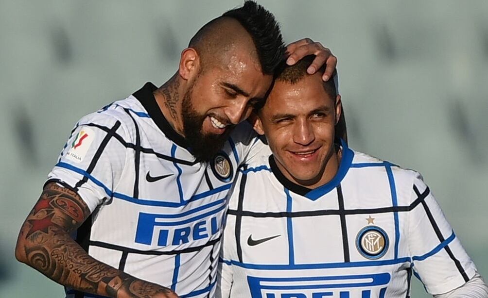 Inter Milan's Chilean midfielder Arturo Vidal (L) celebrates with Inter Milan's Chilean forward Alexis Sanchez after opening the scoring during the Italian Cup (Coppa Italia) round of sixteen football match Fiorentina vs Inter Milan on January 13, 2021 at the Artemio-Franchi stadium in Florence. (Photo by Vincenzo PINTO / AFP) (Photo by VINCENZO PINTO/AFP via Getty Images)