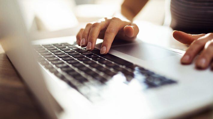 Close up of a young woman working from home