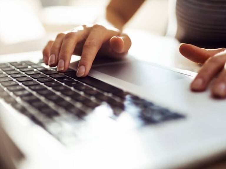 Close up of a young woman working from home