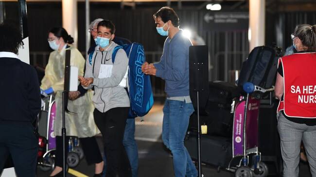 ADELAIDE, AUSTRALIA - JANUARY 14: Rafael Nadal arrives at Adelaide Airport on January 14, 2021 in Adelaide, Australia. All players and staff arriving in Adelaide for the Australian Open must complete 14 days of hotel quarantine before being able to compete in Adelaide and then to Melbourne for the Australian Open and lead up events. Quarantining players will be able to leave their rooms for up to five hours a day, but only to attend dedicated quarantine training venues. Players will only be permitted to train once their day two COVID-19 comes back negative. All other staff and officials will need to remain in their rooms at all times for the 14 days of quarantine. The 2021 Australian Open will be the largest international sporting event to be held in Australia since the beginning of the coronavirus pandemic. (Photo by Mark Brake/Getty Images)