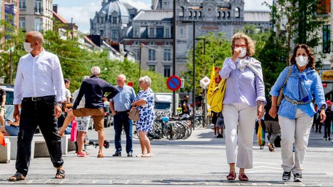 ANTWERP, BELGIUM - 2020/07/20: People wearing face masks as a preventive measure walk on the street during the coronavirus crisis.The wearing of a face mask will become compulsory from Saturday in shops and some other indoor spaces where people gather. (Photo by Robin Utrecht/SOPA Images/LightRocket via Getty Images)