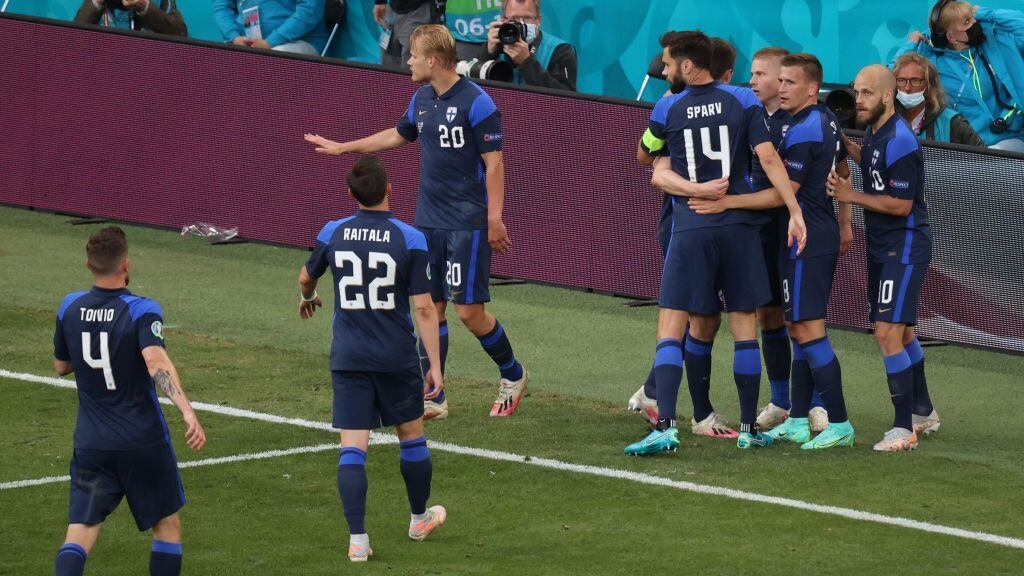 Finland's players react after scoring a goal during the UEFA EURO 2020 Group B football match between Denmark and Finland at the Parken Stadium in Copenhagen on June 12, 2021. (Photo by WOLFGANG RATTAY / POOL / AFP) (Photo by WOLFGANG RATTAY/POOL/AFP via Getty Images)