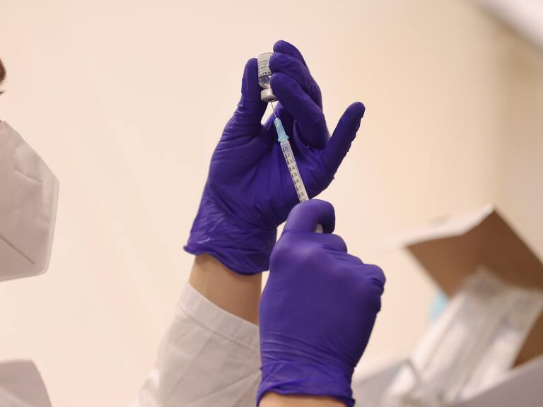 BERLIN, GERMANY - JANUARY 18: A medical assistant prepares syringes with the Pfizer/BioNTech vaccine against Covid-19 at the Humboldt Forum museum during the Omicron wave of the coronavirus pandemic on January 18, 2022 in Berlin, Germany. The museum has launched a three-day vaccination drive for anyone in Berlin seeking a shot. Approximately 73% of the population in Germany is now fully vaccinated. Meanwhile Omicron has fuelled record-breaking rates of new infections since the beginning of the year. (Photo by Sean Gallup/Getty Images)