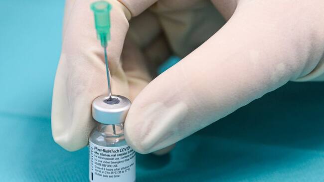 19 February 2021, Saxony, Bannewitz: A vaccination worker prepares the Corona vaccine from Biontech/Pfizer for vaccination in a so-called rolling vaccination centre, which is in Bannewitz near Dresden for a test run. Starting this weekend, so-called rolling vaccination centres will be used in three municipalities in Saxony. Photo: Robert Michael/dpa-Zentralbild/dpa (Photo by Robert Michael/picture alliance via Getty Images)