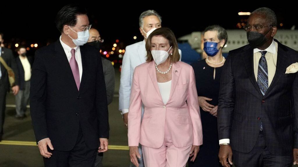 TAIPEI, TAIWAN - AUGUST 2: (----EDITORIAL USE ONLY - MANDATORY CREDIT - "TAIWANESE FOREIGN MINISTRY / HANDOUT" - NO MARKETING NO ADVERTISING CAMPAIGNS - DISTRIBUTED AS A SERVICE TO CLIENTS----) US House Speaker Nancy Pelosi (C) being welcomed by Taiwanese Foreign Minister Joseph Wu (L) after landing at Songshan Airport in Taipei, Taiwan on August 2, 2022. (Photo by Taiwanese Foreign Ministry / Handout/Anadolu Agency via Getty Images)