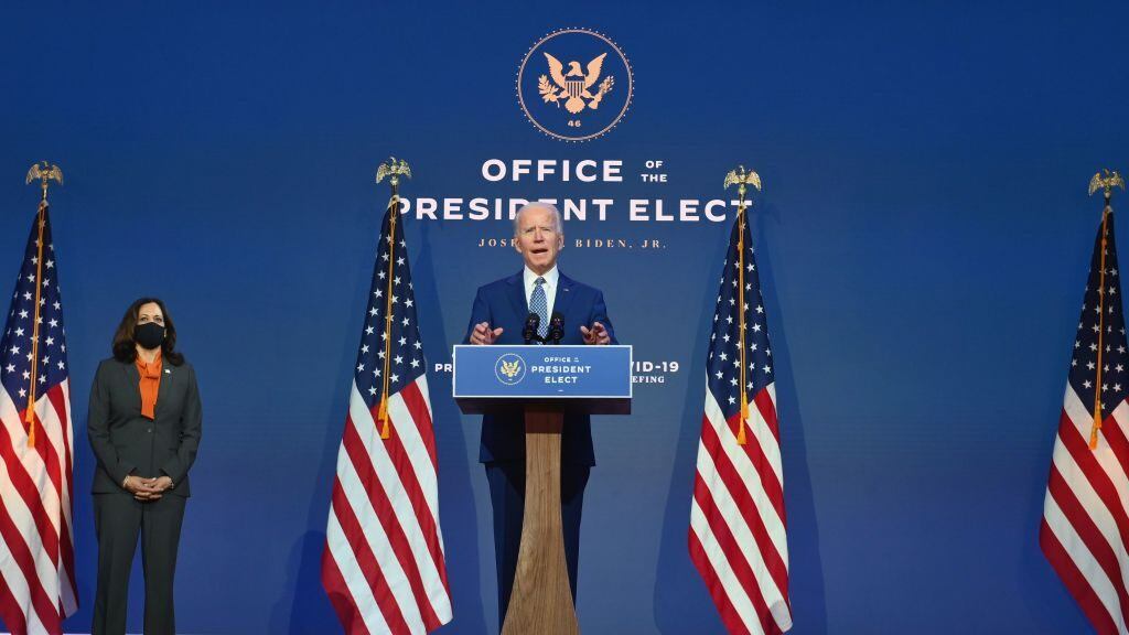 US President-elect Joe Biden delivers remarks as US Vice President-elect Kamala Harris listens at The Queen in Wilmington, Delaware, on November 9, 2020. - President Donald Trump was still refusing to concede his election loss November 9, 2020, but Democrat Joe Biden plowed ahead anyway with the first meeting of a parallel coronavirus task force, initiating an awkward and potentially volatile transition period. (Photo by Angela Weiss / AFP) (Photo by ANGELA WEISS/AFP via Getty Images)