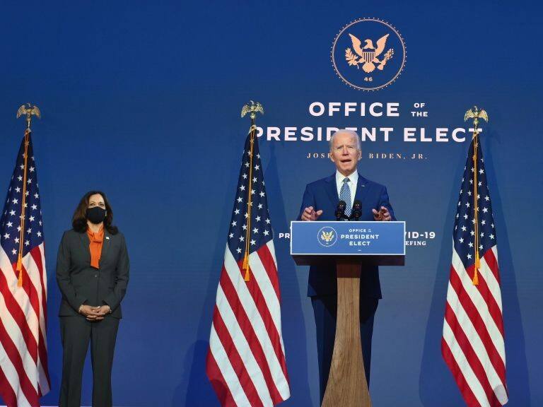 US President-elect Joe Biden delivers remarks as US Vice President-elect Kamala Harris listens at The Queen in Wilmington, Delaware, on November 9, 2020. - President Donald Trump was still refusing to concede his election loss November 9, 2020, but Democrat Joe Biden plowed ahead anyway with the first meeting of a parallel coronavirus task force, initiating an awkward and potentially volatile transition period. (Photo by Angela Weiss / AFP) (Photo by ANGELA WEISS/AFP via Getty Images)