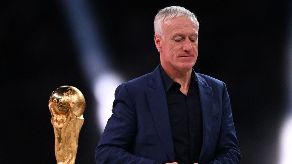 France's coach Didier Deschamps looks dejected as he walks past the World Cup trophy during the trophy ceremony after France lost the Qatar 2022 World Cup final football match between Argentina and France at Lusail Stadium in Lusail, north of Doha on December 18, 2022. (Photo by Kirill KUDRYAVTSEV / AFP) (Photo by KIRILL KUDRYAVTSEV/AFP via Getty Images)