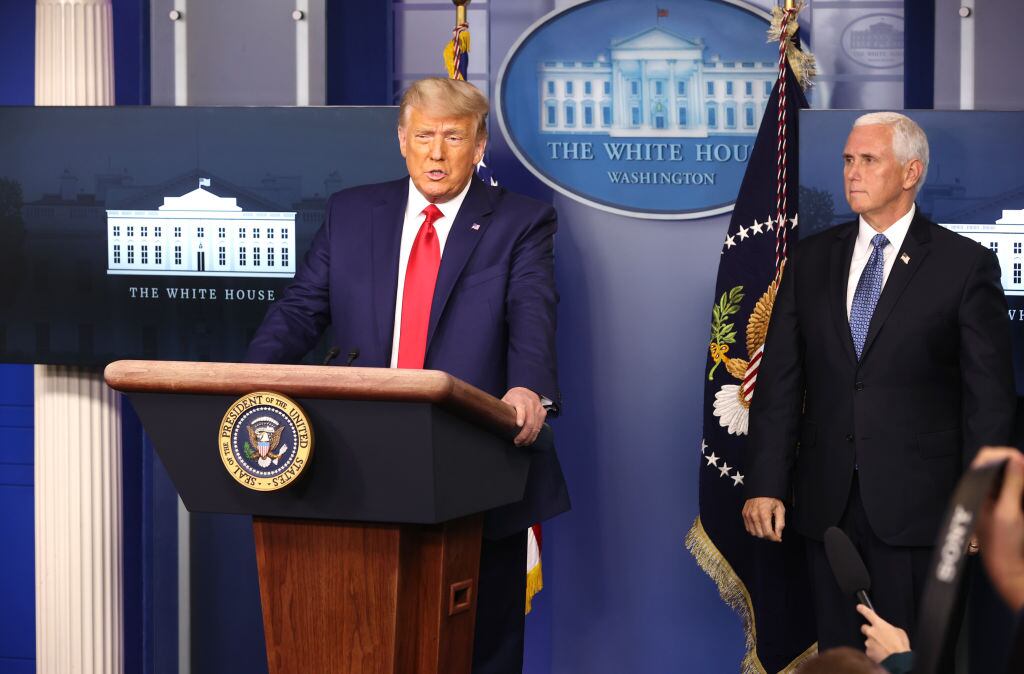WASHINGTON, DC - NOVEMBER 24: U.S. President Donald Trump (L) speaks as Vice President Mike Pence (R) looks on in the James Brady Press Briefing Room at the White House on November 24, 2020 in Washington, DC. Trump made brief remarks about the stock market hitting 30,000. (Photo by Chip Somodevilla/Getty Images)