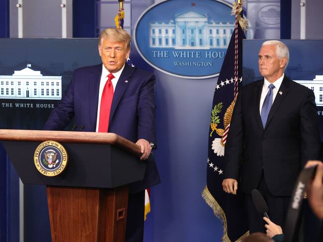 WASHINGTON, DC - NOVEMBER 24: U.S. President Donald Trump (L) speaks as Vice President Mike Pence (R) looks on in the James Brady Press Briefing Room at the White House on November 24, 2020 in Washington, DC. Trump made brief remarks about the stock market hitting 30,000. (Photo by Chip Somodevilla/Getty Images)