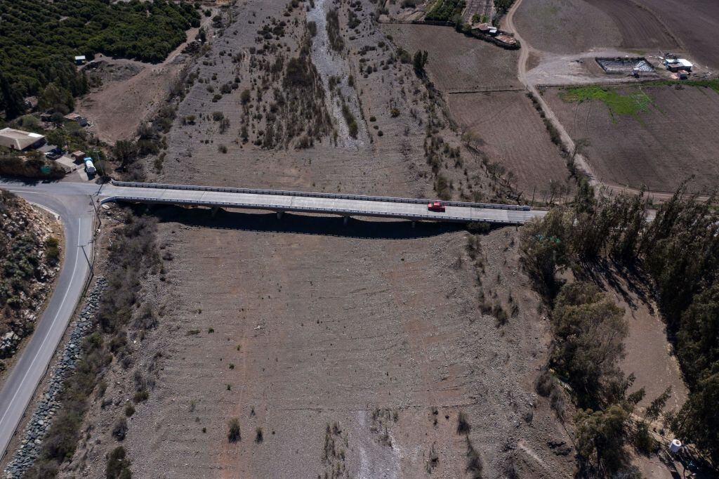 Aerial view of the dried out bed of La Ligua river in Petorca province, Valparaiso Region, Chile on September 12, 2019. - Chile's President Sebastian Pinera decreed on September 16, 2019, a catastrophe zone in the Valparaíso region (center), where the extensive drought hitting the area is compromising livestock and agricultural production. (Photo by MARTIN BERNETTI / AFP) (Photo credit should read MARTIN BERNETTI/AFP via Getty Images)