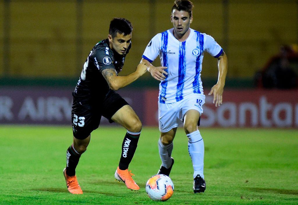 Uruguay's Cerro Largo player Tomas Fernandez (R) and Chile's Palestino player Renato Tarifeno vie for the ball during their Copa Libertadores football match at Domingo Burgueno stadium in Maldonado, Uruguay, on February 5, 2020. (Photo by Dante Fernandez / AFP) (Photo by DANTE FERNANDEZ/AFP via Getty Images)