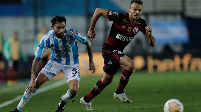 AVELLANEDA, ARGENTINA - NOVEMBER 24: Eugenio Mena of Racing Club fights for the ball with Rene of Flamengo during a round of sixteen first leg match between Racing Club and Flamengo at Presidente Peron Stadium on November 24, 2020 in Avellaneda, Argentina. (Photo by Juan Ignacio Roncoroni - Pool/Getty Images)