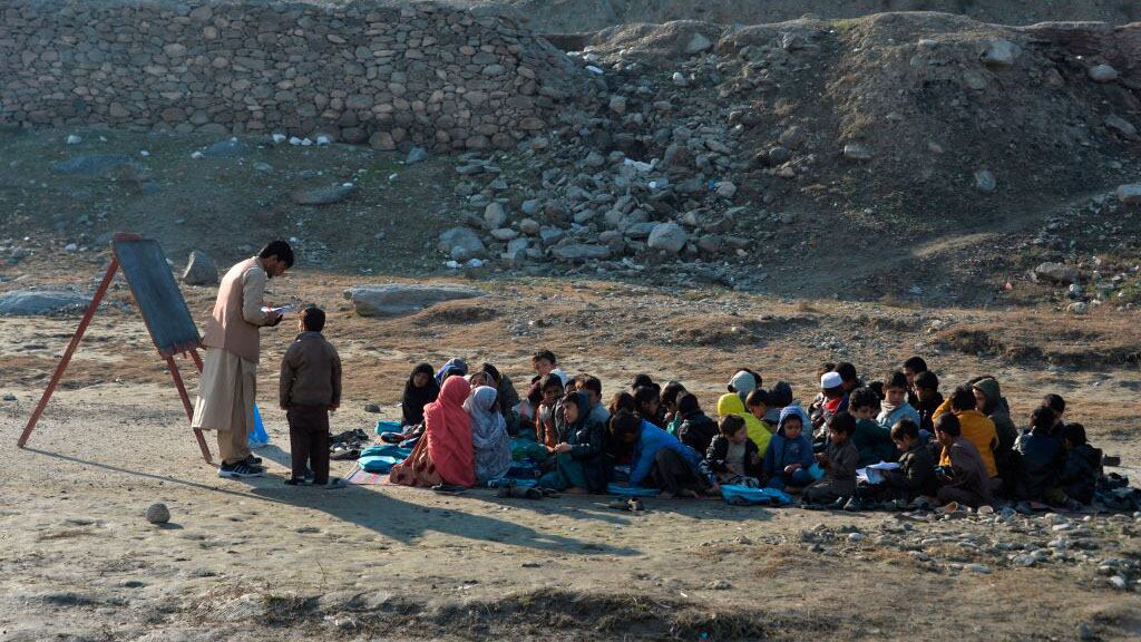 TOPSHOT - School children take part in a lesson in an open-air classroom in Qarghayi district of Laghman Province on January 20, 2020. (Photo by NOORULLAH SHIRZADA / AFP) (Photo by NOORULLAH SHIRZADA/AFP via Getty Images)