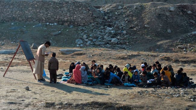 TOPSHOT - School children take part in a lesson in an open-air classroom in Qarghayi district of Laghman Province on January 20, 2020. (Photo by NOORULLAH SHIRZADA / AFP) (Photo by NOORULLAH SHIRZADA/AFP via Getty Images)