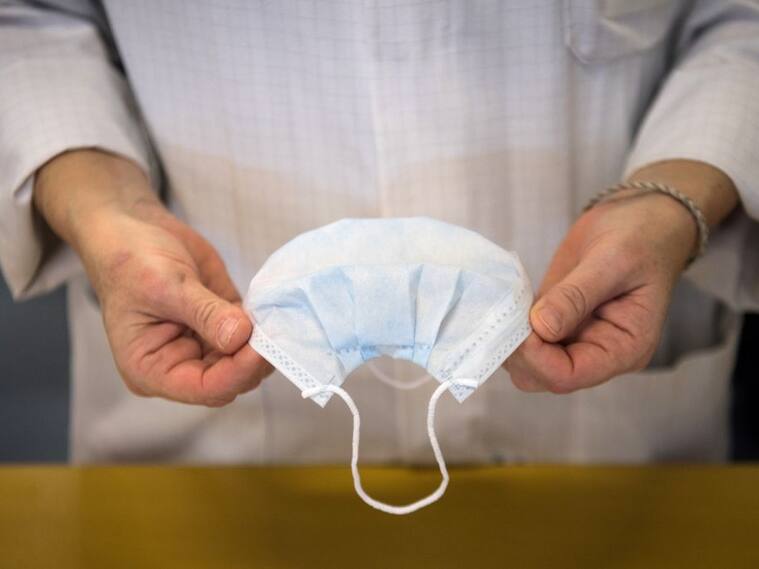 TOPSHOT - An employee controls health protection masks in a production chain of the Kolmi-Hopen company's factory, on February 1, 2020 in Saint-Barthelemy-d'Anjou, western France. - The company indicated receiving hundreds of millions of orders for health protection masks due to cases of coronavirus that emerged in a market in the central Chinese city of Wuhan. The coronavirus outbreak has so far killed more than 250 people and infected thousands in mainland China and beyond and has forced governments around the world to take drastic measures. (Photo by Loic VENANCE / AFP) (Photo by LOIC VENANCE/AFP via Getty Images)