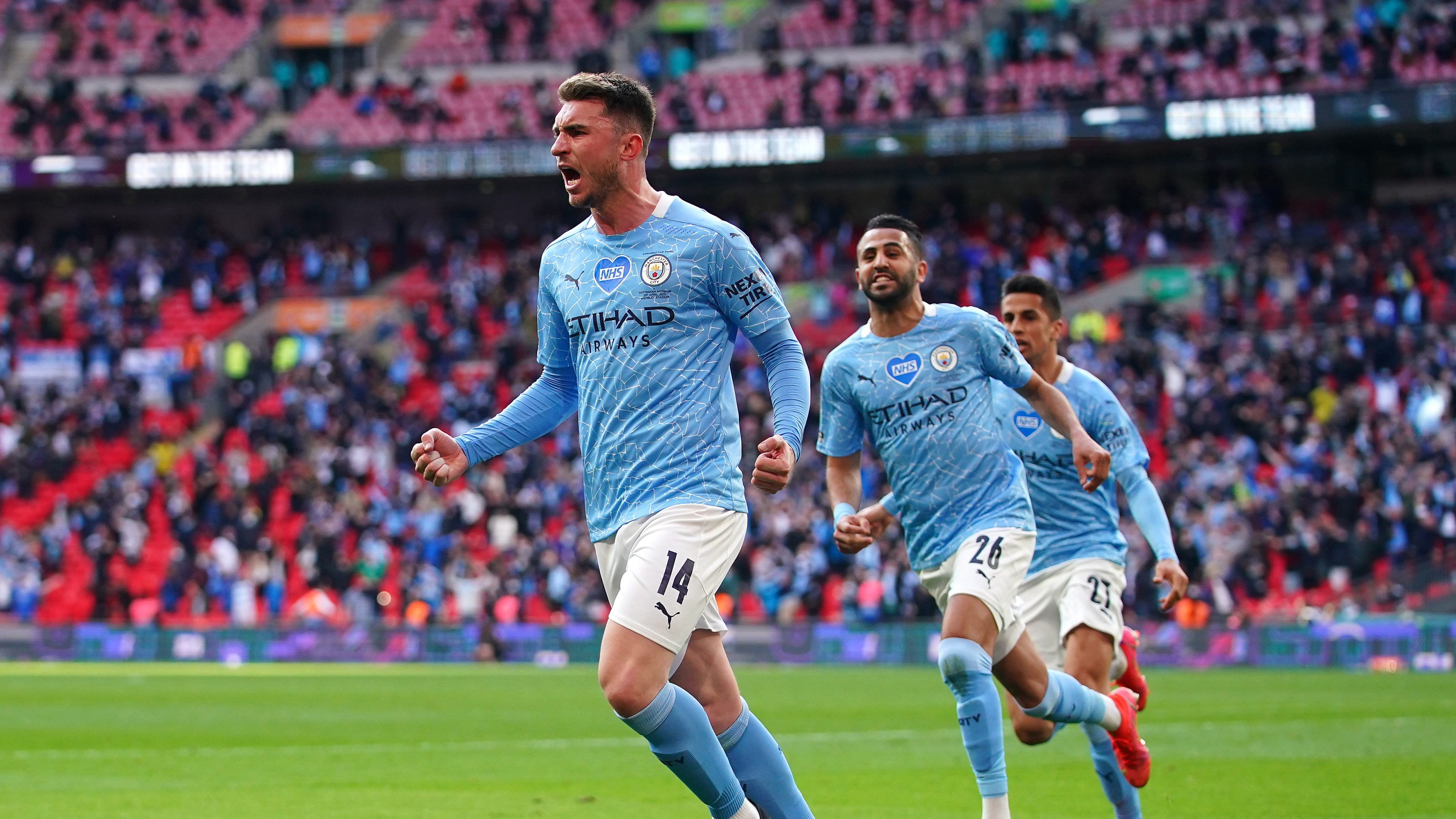 LONDON, ENGLAND - APRIL 25: Aymeric Laporte of Manchester City celebrates after scoring their side's first goal during the Carabao Cup Final between Manchester City and Tottenham Hotspur at Wembley Stadium on April 25, 2021 in London, England. 8,000 fans are due to watch the game at Wembley, the most at an outdoor sporting event in the UK since the coronavirus pandemic started in March, 2020. Each team has been given an allocation of 2,000 with the remaining tickets split between local residents and NHS staff. (Photo by Matt McNulty - Manchester City/Manchester City FC via Getty Images)
