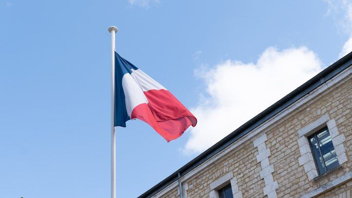 french flag at the top of a mat in a barracks blue white red