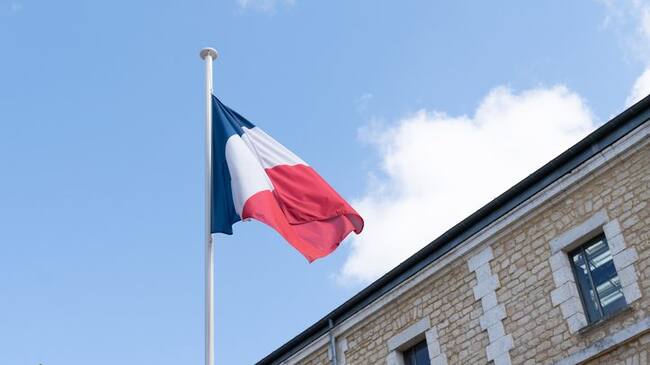french flag at the top of a mat in a barracks blue white red