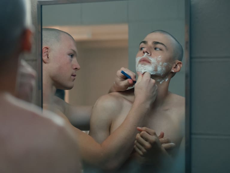 BOOTS. (L to R) Angus O'Brien as Hicks and Miles Heizer as Cameron Cope in Episode 101 of BOOTS. Cr. Courtesy of Netflix © 2025