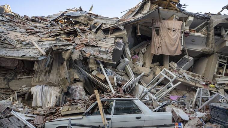 ELAZIG, TURKEY - JANUARY 25: A car stuck in the rubble after a 6.8-magnitude earthquake jolted eastern Turkish province of Elazig on January 25, 2020. Search and rescue efforts are underway after a deadly earthquake rattled eastern Turkey, killing at least 20 people and injuring more than 1,015 others, according to authorities (Photo by Ali Balikci/Anadolu Agency via Getty Images)