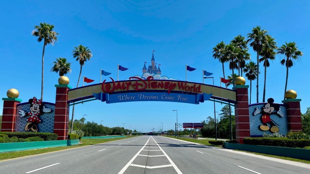 An empty road leads into a deserted Disney resort after it was closed due to the COVID-19 pandemic in Kissimmee, Florida on May 5, 2020. (Photo by Daniel SLIM / AFP) (Photo by DANIEL SLIM/AFP via Getty Images)