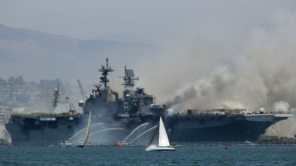SAN DIEGO, CALIFORNIA - JULY 12: A fire burns on the amphibious assault ship USS Bonhomme Richard at Naval Base San Diego on July 12, 2020 in San Diego, California. There was an explosion on board the ship with multiple injuries reported. (Photo by Sean M. Haffey/Getty Images)