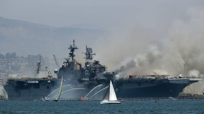 SAN DIEGO, CALIFORNIA - JULY 12: A fire burns on the amphibious assault ship USS Bonhomme Richard at Naval Base San Diego on July 12, 2020 in San Diego, California. There was an explosion on board the ship with multiple injuries reported. (Photo by Sean M. Haffey/Getty Images)