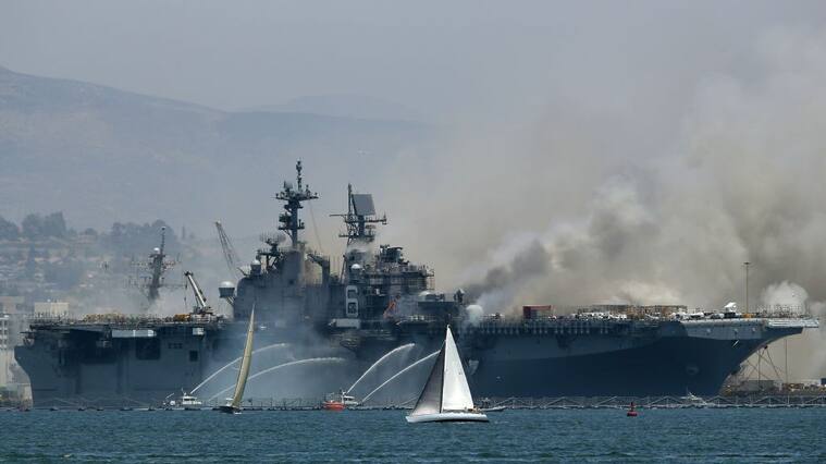SAN DIEGO, CALIFORNIA - JULY 12: A fire burns on the amphibious assault ship USS Bonhomme Richard at Naval Base San Diego on July 12, 2020 in San Diego, California. There was an explosion on board the ship with multiple injuries reported. (Photo by Sean M. Haffey/Getty Images)