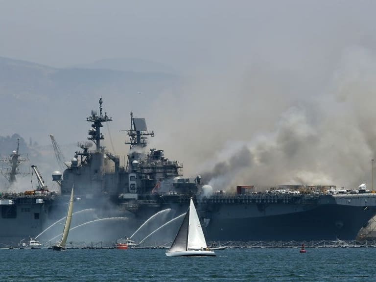 SAN DIEGO, CALIFORNIA - JULY 12:  A fire burns on the amphibious assault ship USS Bonhomme Richard at Naval Base San Diego on July 12, 2020 in San Diego, California. There was an explosion on board the ship with multiple injuries reported.  (Photo by Sean M. Haffey/Getty Images)