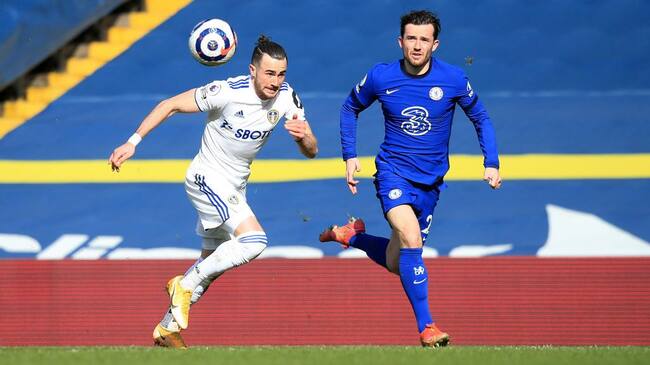 LEEDS, ENGLAND - MARCH 13: Ben Chilwell of Chelsea battles for possession with Jack Harrison of Leeds United during the Premier League match between Leeds United and Chelsea at Elland Road on March 13, 2021 in Leeds, England. Sporting stadiums around the UK remain under strict restrictions due to the Coronavirus Pandemic as Government social distancing laws prohibit fans inside venues resulting in games being played behind closed doors. (Photo by Lindsey Parnaby - Pool/Getty Images)
