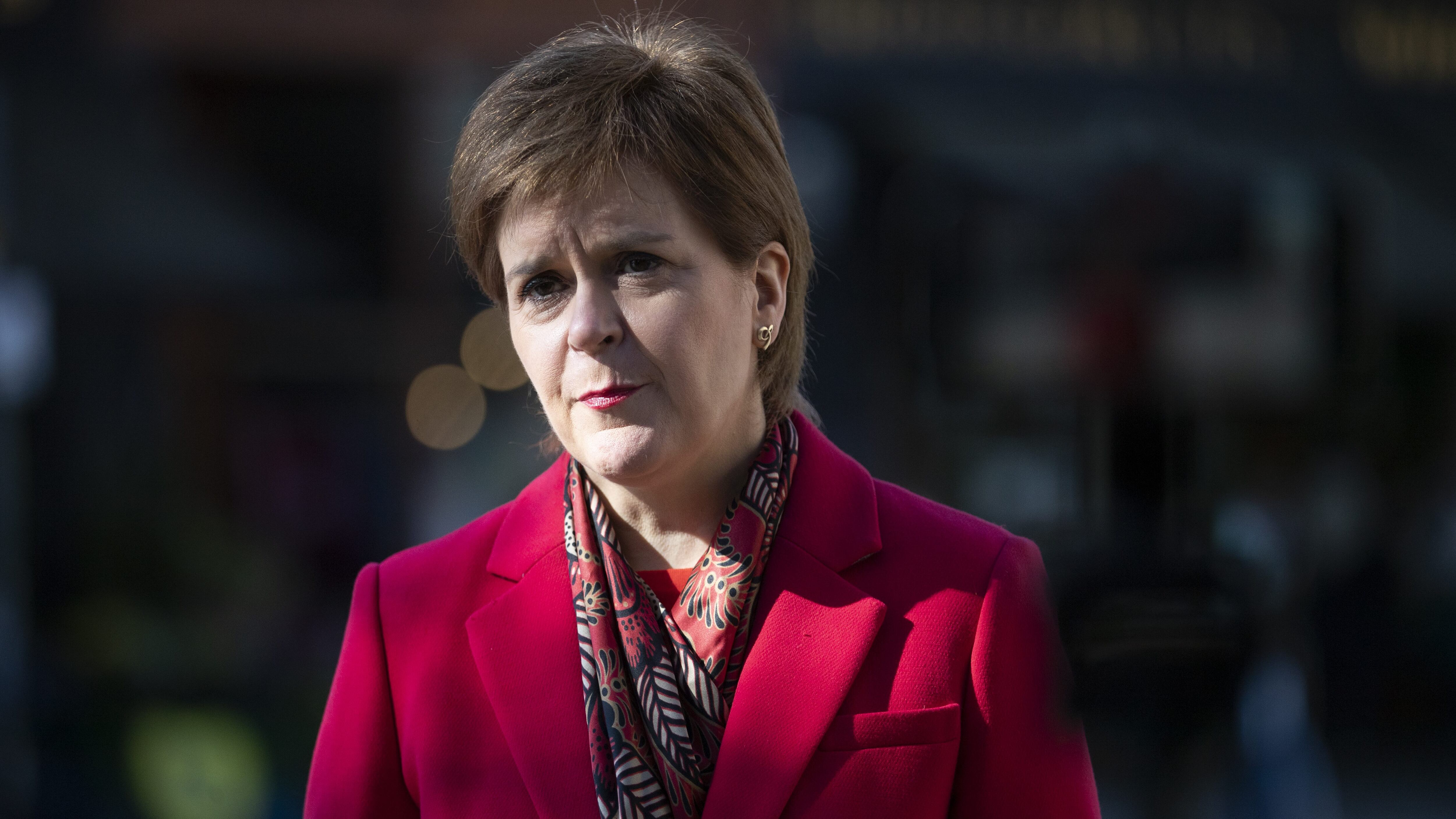 GLASGOW, SCOTLAND - APRIL 02: Scotland's First Minister and leader of the Scottish National Party (SNP) Nicola Sturgeon speaks to the media after visiting the Roots, Fruits and Flowers store in Glasgow's West End on the campaign trail for the forthcoming Scottish Parliamentary Election on April 2, 2021 in Glasgow, Scotland. The Scottish National Party (SNP) is the largest political party in Scotland with 125,691 members and 61 MSPs in the Holyrood parliaments. They stand on a centre-left platform advocating an independent Scotland, nuclear disarmament and social democracy. Scottish voters go to the polls to elect their parliament on May 6, 2021. (Photo by Jane Barlow - Pool/Getty Images)