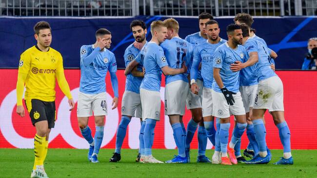 DORTMUND, GERMANY - APRIL 14:(BILD ZEITUNG OUT) Riyad Mahrez of Manchester City celebrates after scoring his team's second goal with teammates during the UEFA Champions League Quarter Final Second Leg match between Borussia Dortmund and Manchester City at Signal Iduna Park on April 14, 2021 in Dortmund, Germany. (Photo by Alex Gottschalk/DeFodi Images via Getty Images)
