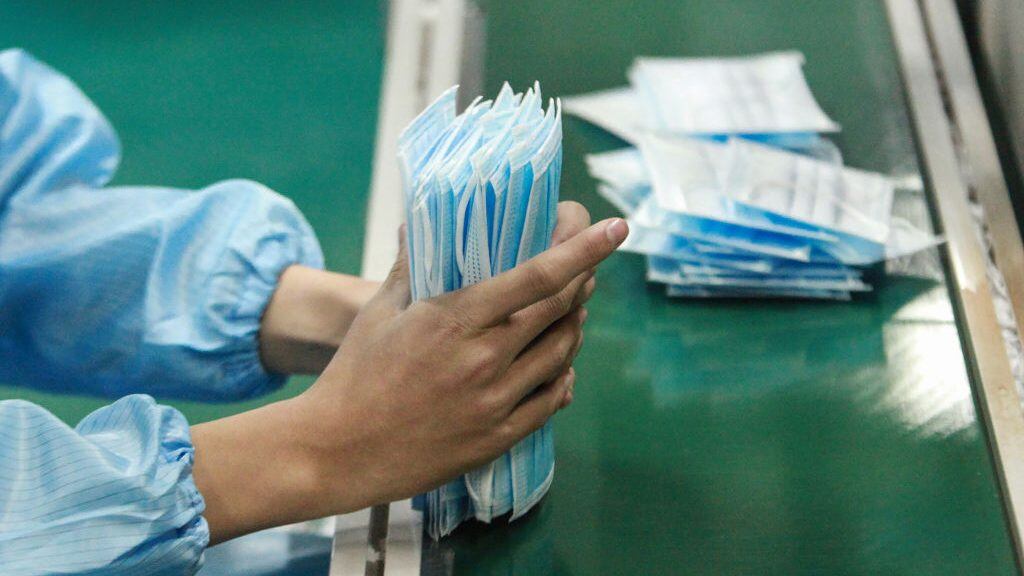 This photo taken on January 26, 2020 shows a worker producing facemasks at a factory in Yangzhou in China's eastern Jiangsu province, to support the supply of medical materials during a deadly virus outbreak which began in Wuhan. - At least 81 people have died since the new strain of coronavirus emerged in China's Wuhan, and millions are now under an effective quarantine, with all flights in and out of the city grounded and a ban on Chinese tour groups domestically and abroad. (Photo by STR / AFP) / China OUT (Photo by STR/AFP via Getty Images)