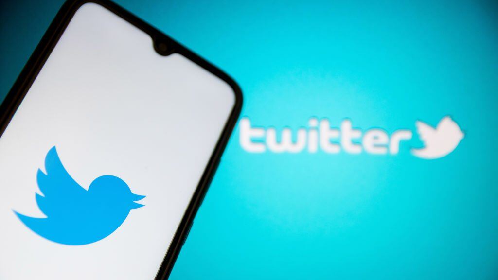In this photo illustration a Twitter logo seen displayed on a smartphone screen with Twitter logo in the background in Athens, Greece on July 11, 2022. (Photo by Nikolas Kokovlis/NurPhoto via Getty Images)