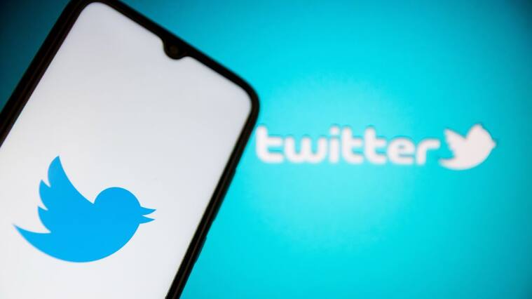 In this photo illustration a Twitter logo seen displayed on a smartphone screen with Twitter logo in the background in Athens, Greece on July 11, 2022. (Photo by Nikolas Kokovlis/NurPhoto via Getty Images)