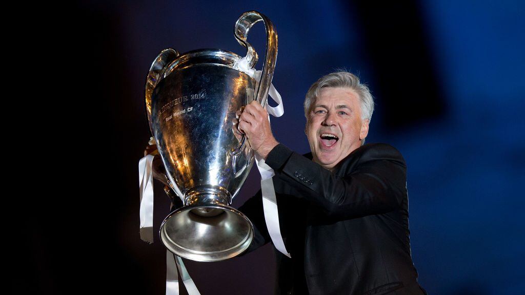 MADRID, SPAIN - MAY 25: Head coach Carlo Ancelotti of Real Madrid CF holds the UEFA Champions League cup celebrating their victory on the UEFA Champions League Final match against Club Atletico de Madrid at Cibeles square on the early morning of May, 25, 2014 in Madrid, Spain. Real Madrid CF achieves their 10th European Cup at Lisbon 12 years later. (Photo by Gonzalo Arroyo Moreno/Getty Images)