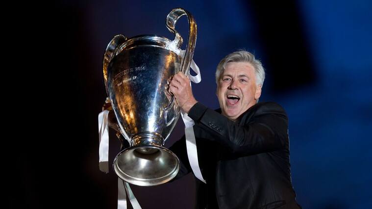 MADRID, SPAIN - MAY 25: Head coach Carlo Ancelotti of Real Madrid CF holds the UEFA Champions League cup celebrating their victory on the UEFA Champions League Final match against Club Atletico de Madrid at Cibeles square on the early morning of May, 25, 2014 in Madrid, Spain. Real Madrid CF achieves their 10th European Cup at Lisbon 12 years later. (Photo by Gonzalo Arroyo Moreno/Getty Images)