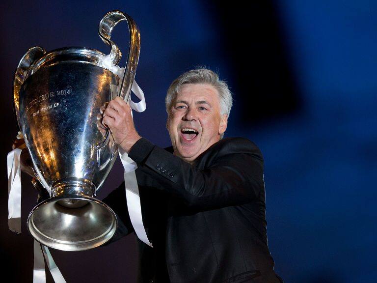 MADRID, SPAIN - MAY 25: Head coach Carlo Ancelotti of Real Madrid CF holds the UEFA Champions League cup celebrating their victory on the UEFA Champions League Final match against Club Atletico de Madrid at Cibeles square on the early morning of May, 25, 2014 in Madrid, Spain. Real Madrid CF achieves their 10th European Cup at Lisbon 12 years later. (Photo by Gonzalo Arroyo Moreno/Getty Images)