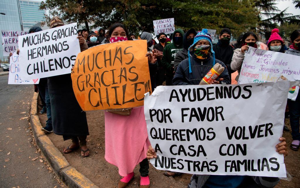 Stranded Bolivian citizens remain at a makeshift camp in front of Bolivia's consulate in Santiago, on June 02, 2020 waiting for a solution to their situation as the borders were closed due to the coronavirus COVID-19 pandemic. (Photo by Martin BERNETTI / AFP) (Photo by MARTIN BERNETTI/AFP via Getty Images)