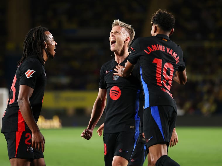 LAS PALMAS, SPAIN - FEBRUARY 22: Dani Olmo of FC Barcelona celebrates with his team mates Jules Kounde and Lamine Yamal after scoring his team's first goal during the LaLiga match between UD Las Palmas and FC Barcelona at Estadio Gran Canaria on February 22, 2025 in Las Palmas, Spain. (Photo by Florencia Tan Jun/Getty Images)