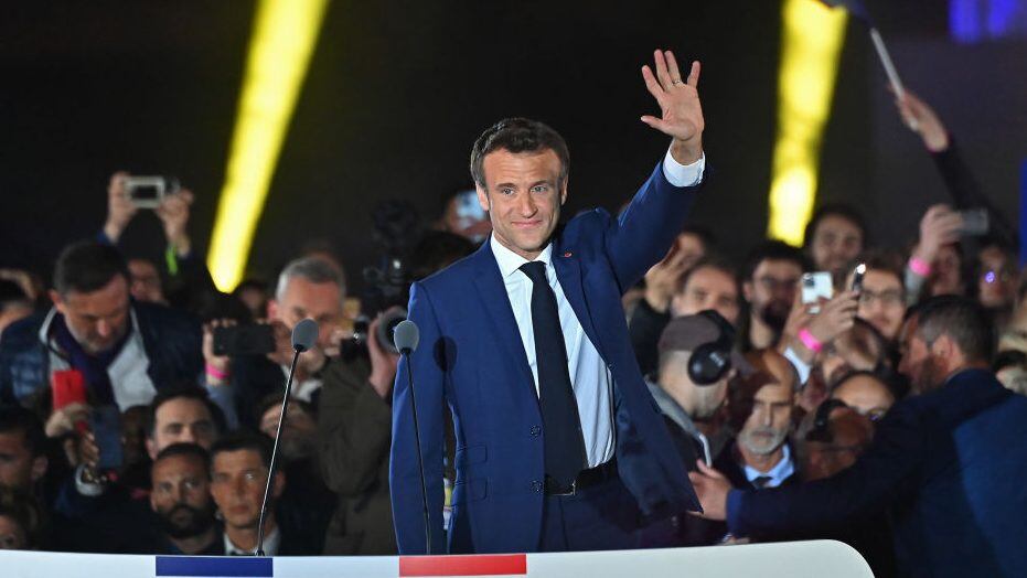 PARIS, FRANCE - APRIL 24: France's centrist incumbent president Emmanuel Macron adresses voters in front of the Eiffel Tower after beating his far-right rival Marine Le Pen for a second five-year term as president with 58,8% votes on April 24, 2022 in Paris, France. Emmanuel Macron and Marine Le Pen both qualified on Sunday April 10th for France's 2022 presidential election second round held today, on April 24. This is the second consecutive time the two candidates face-off in the final round of elections. (Photo by Aurelien Meunier/Getty Images)