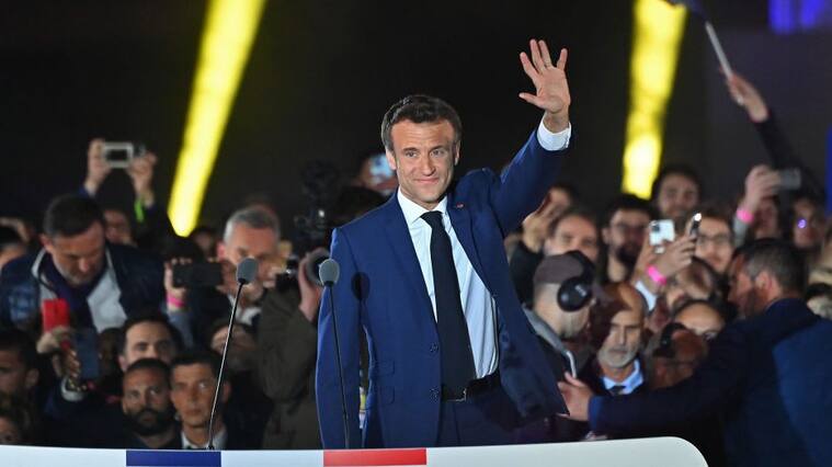PARIS, FRANCE - APRIL 24: France's centrist incumbent president Emmanuel Macron adresses voters in front of the Eiffel Tower after beating his far-right rival Marine Le Pen for a second five-year term as president with 58,8% votes on April 24, 2022 in Paris, France. Emmanuel Macron and Marine Le Pen both qualified on Sunday April 10th for France's 2022 presidential election second round held today, on April 24. This is the second consecutive time the two candidates face-off in the final round of elections. (Photo by Aurelien Meunier/Getty Images)