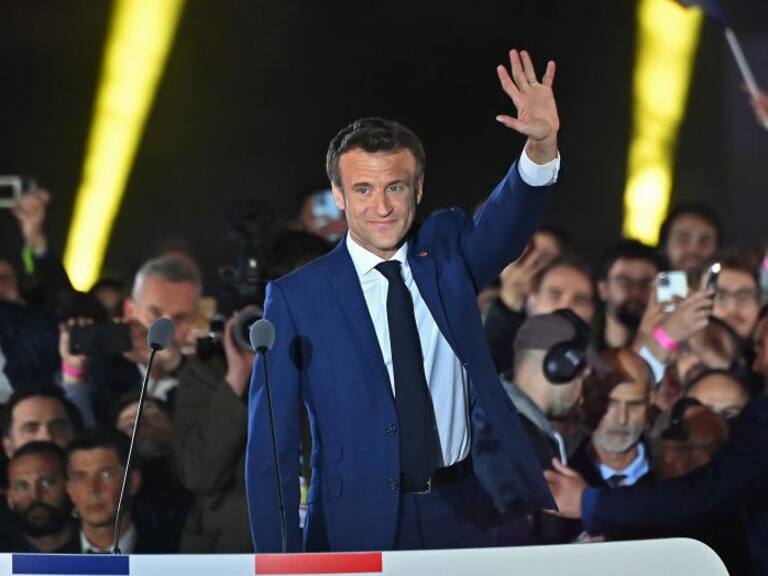PARIS, FRANCE - APRIL 24: France's centrist incumbent president Emmanuel Macron adresses voters in front of the Eiffel Tower after beating his far-right rival Marine Le Pen for a second five-year term as president with 58,8% votes on April 24, 2022 in Paris, France. Emmanuel Macron and Marine Le Pen both qualified on Sunday April 10th for France's 2022 presidential election second round held today, on April 24. This is the second consecutive time the two candidates face-off in the final round of elections. (Photo by Aurelien Meunier/Getty Images)