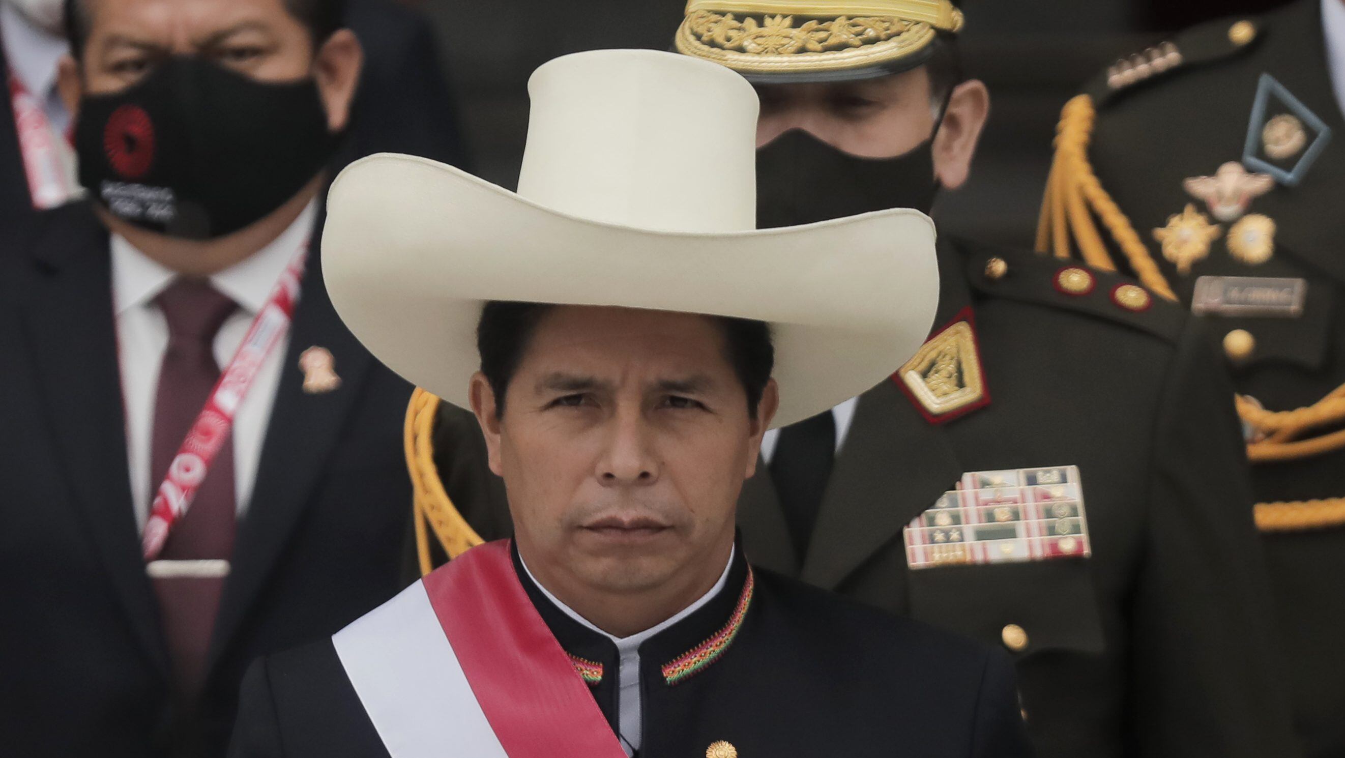 LIMA, PERU - JULY 28: President of Peru Pedro Castillo walks out of Congress wearing the presidential sash after the presidential inauguration on July 28, 2021 in Lima, Peru. Castillo of Peru Libre defeated Keiko Fujimori of Fuerza Popular by a slight difference in the runoff on June 6. Peruvians are also celebrating the 200th anniversary of their independence. (Photo by Getty Images/Getty Images)
